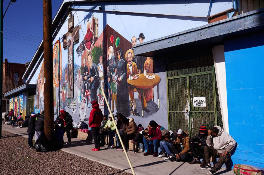 Migrants gather near Sacred Heart Church on Dec. 17, 2022 in El Paso, Texas.