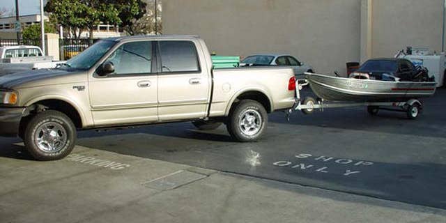 A boat and truck that belong to Scott Peterson. It was learned later in the case that he used the boat to transport Laci Peterson before she went missing.