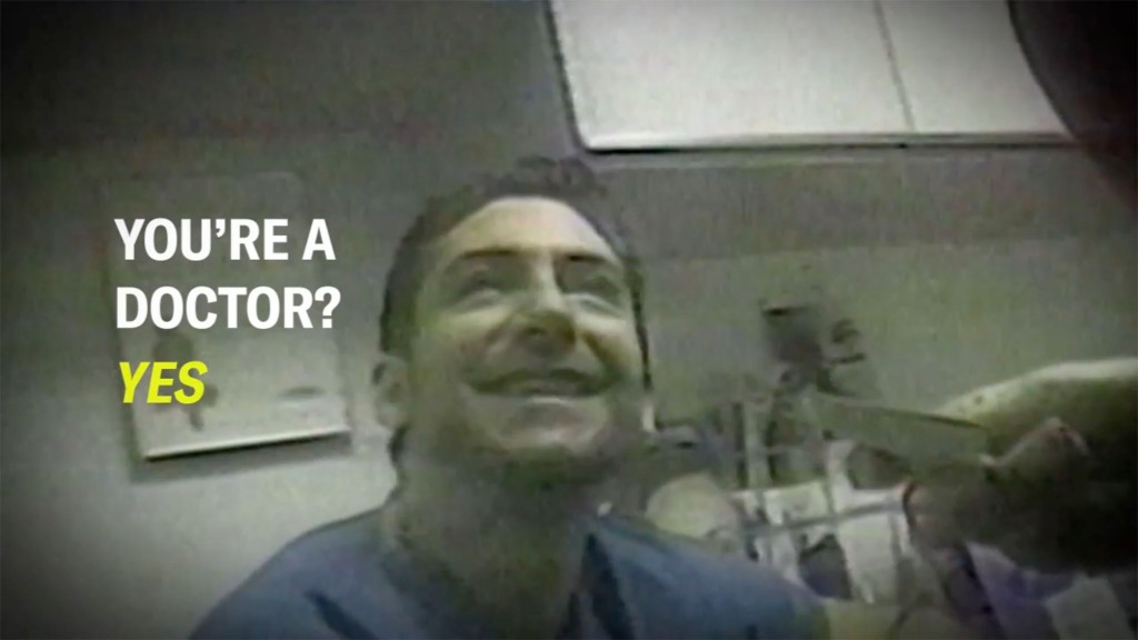 Pictured is a covert video still of Faiello lying to a would-be patient about his medical credentials.