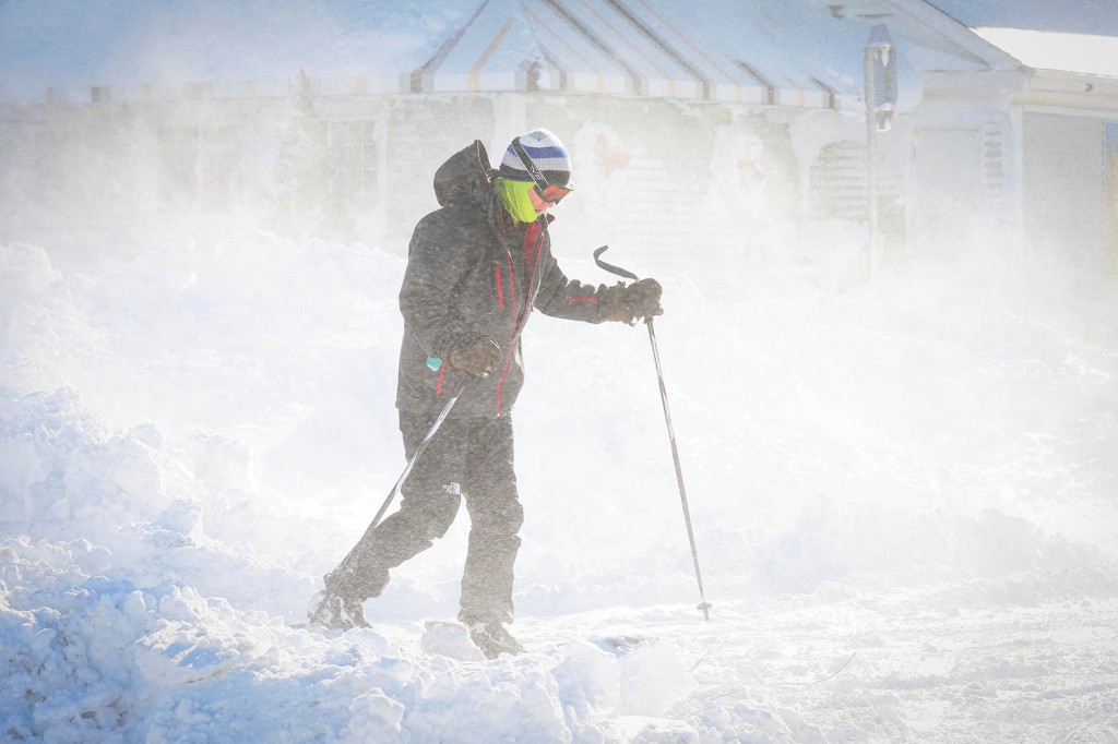 A man skis following a winter storm that hit the Buffalo region on Main St. in Amherst, New York.