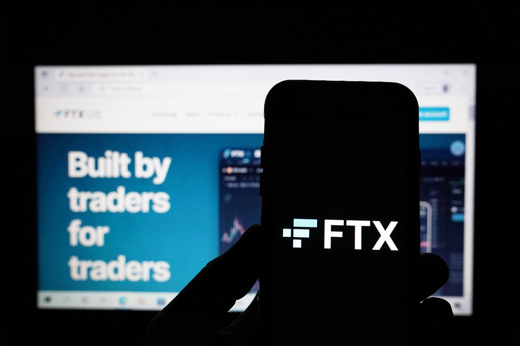 A general view of the FTX website and FTX logo as seen on a computer screen