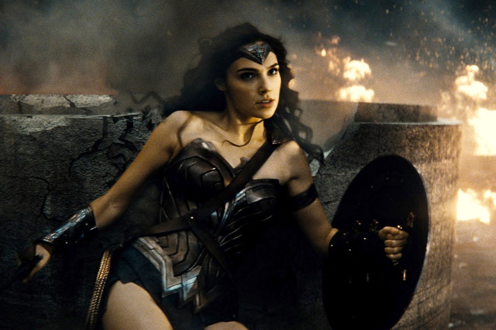 Gal Gadot holding a shield as Wonder Woman. 