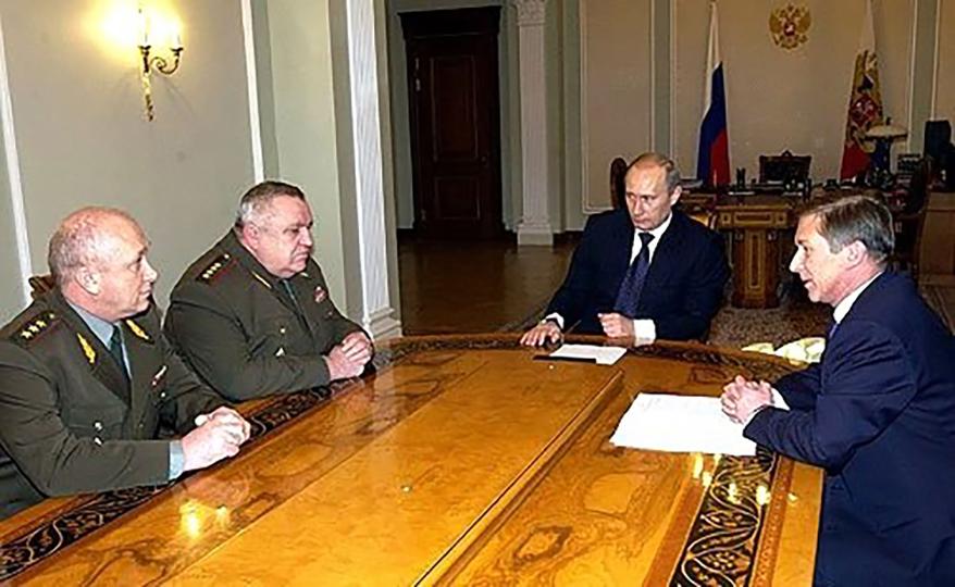 General Alexei Maslov, first from the left, meets Vladimir Putin in 2004 during a meeting.