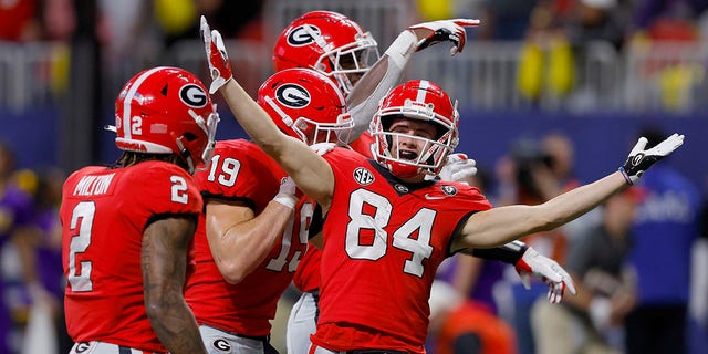 Ladd McConkey (84) of the Georgia Bulldogs celebrates with his teammates after scoring a 22-yard touchdown against the LSU Tigers during the second quarter of the SEC championship game at Mercedes-Benz Stadium Dec. 3, 2022, in Atlanta. 