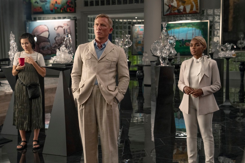 Jessica Henwick, left, Daniel Craig, center, and Janelle Monáe in a scene from "Glass Onion: A Knives Out Mystery." 