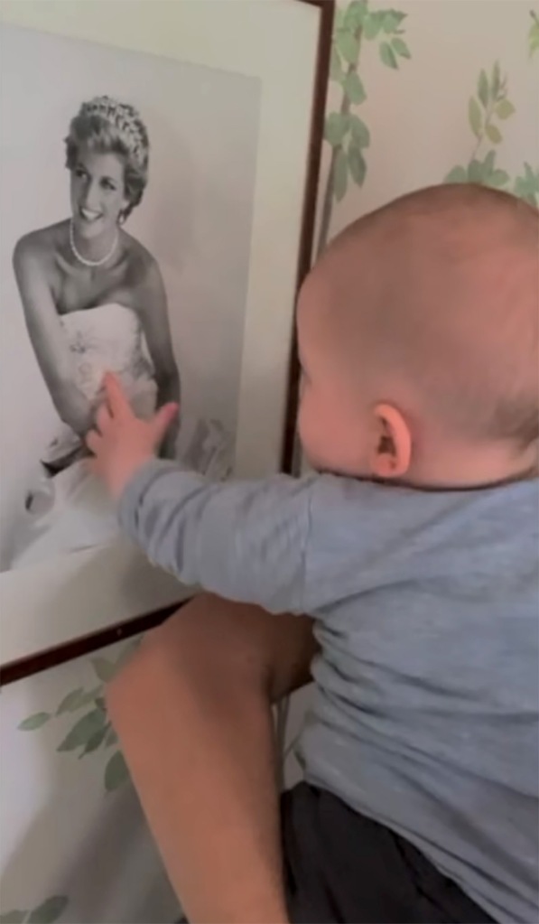 Archie reaches for an image of his late grandmother, Princess Diana.