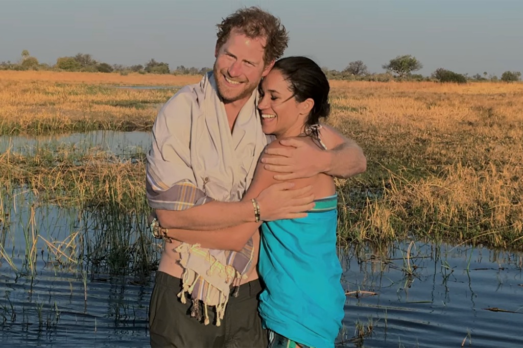 Harry and Meghan embrace during a trip to Africa.