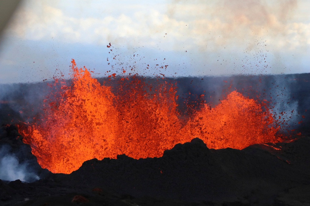 lava flows on Mauna Loa, the world's largest active volcano, on Wednesday, Nov. 30, 2022, near Hilo, Hawaii.