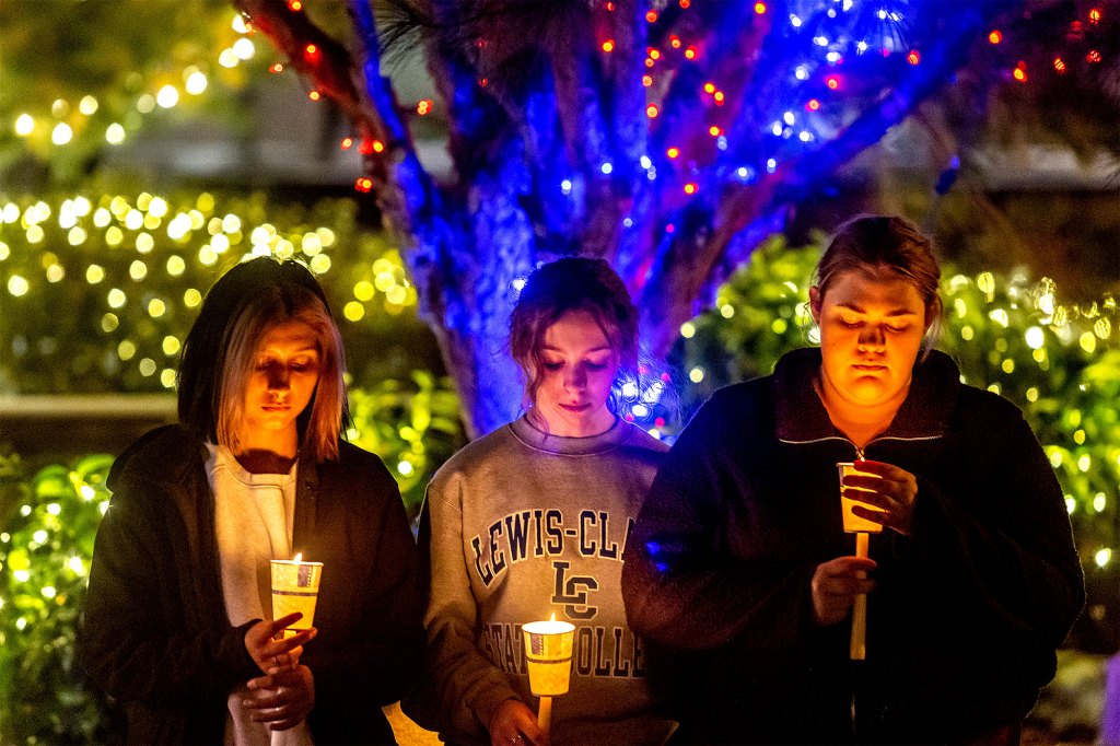 Mourners pay their respect at a vigil held for the slain University of Idaho students in Lewiston, Idaho.