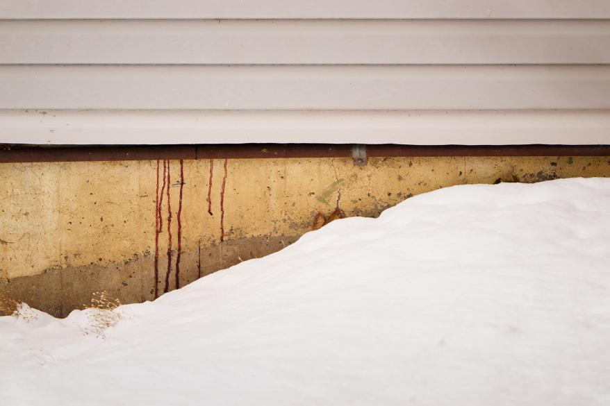 Blood seeps through wall of murder house