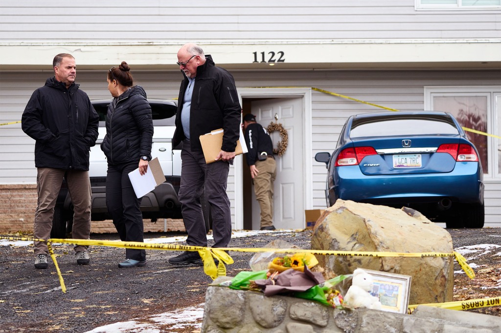 Investigators examining the crime scene