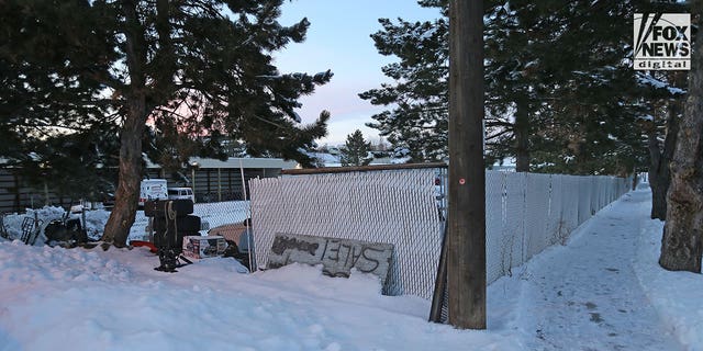 Vehicles that had been parked at the home of the murdered University of Idaho students are stored in an outdoor car lot after being towed from the crime scene.