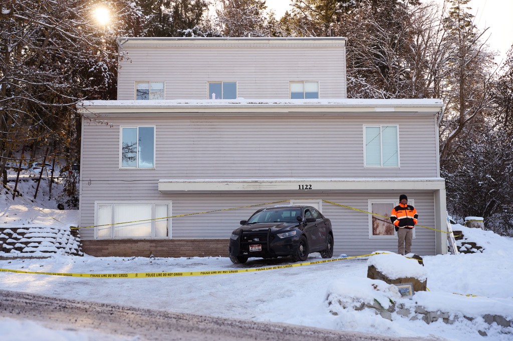 Private security guard outside the off-campus home where four students were butchered Nov. 13.