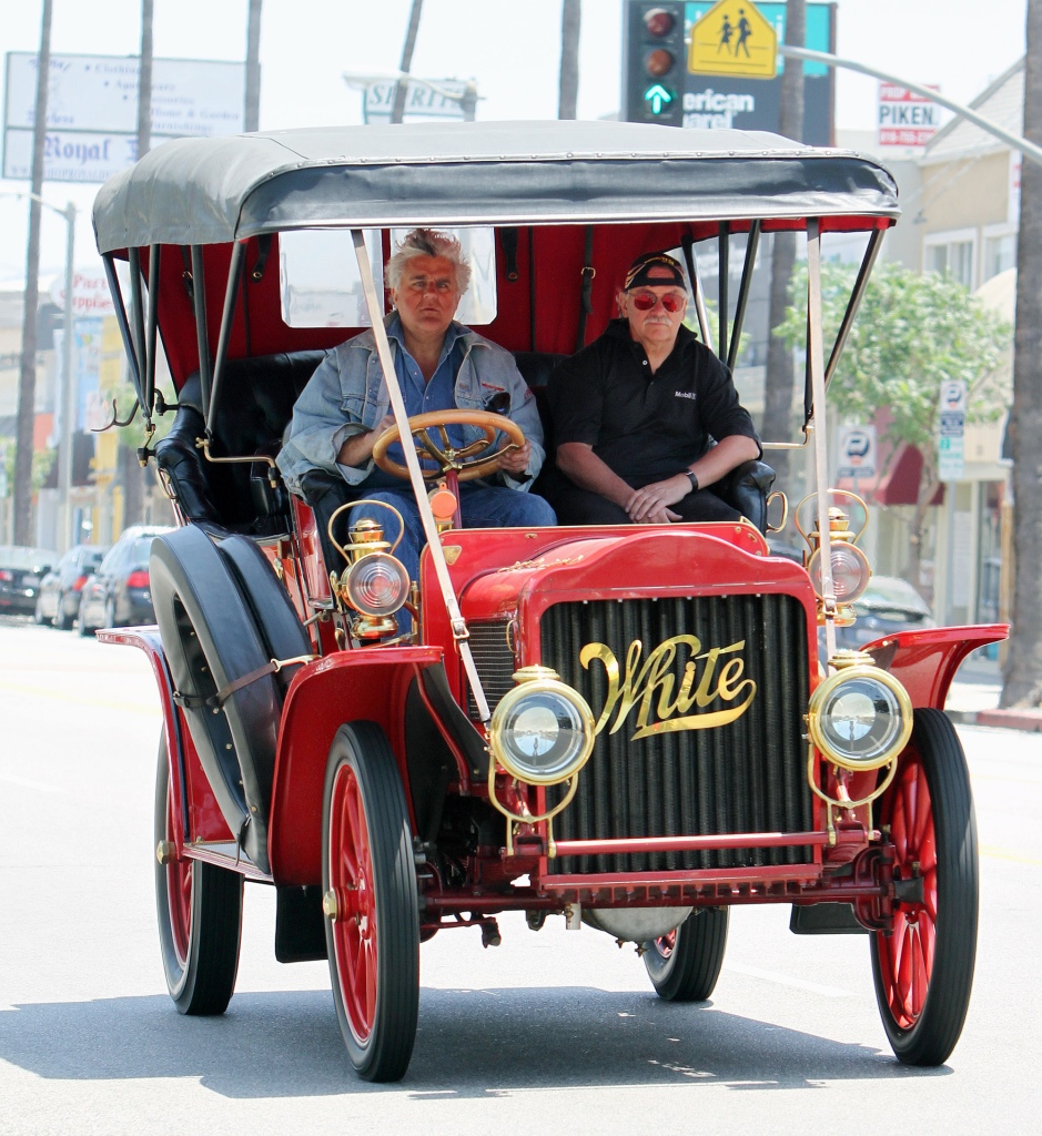 Photos from July 2010 show Jay Leno driving around Los Angeles in his 1908 White Steam Car, which exploded in the garage fire. 