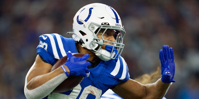 Jonathan Taylor, #28 of the Indianapolis Colts, carries the ball against the Dallas Cowboys during the first half at AT&amp;T Stadium on Dec. 4, 2022 in Arlington, Texas.