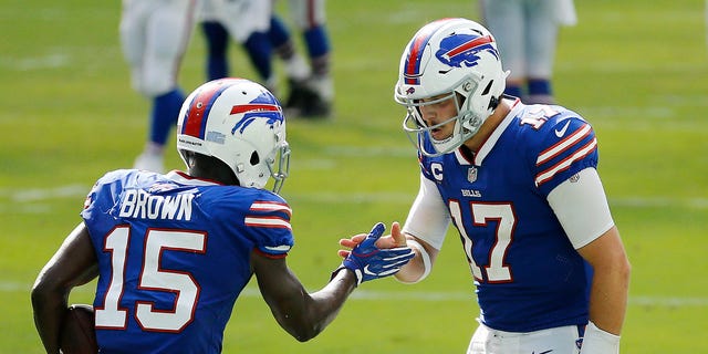 Josh Allen (17) of the Buffalo Bills celebrates with John Brown after a 46-yard touchdown against the Miami Dolphins during the fourth quarter at Hard Rock Stadium on Sept. 20, 2020, in Miami Gardens, Florida.