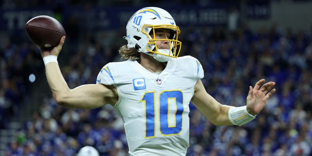 Justin Herbert #10 of the Los Angeles Chargers throws the ball against the Indianapolis Colts at Lucas Oil Stadium on December 26, 2022, in Indianapolis, Indiana.