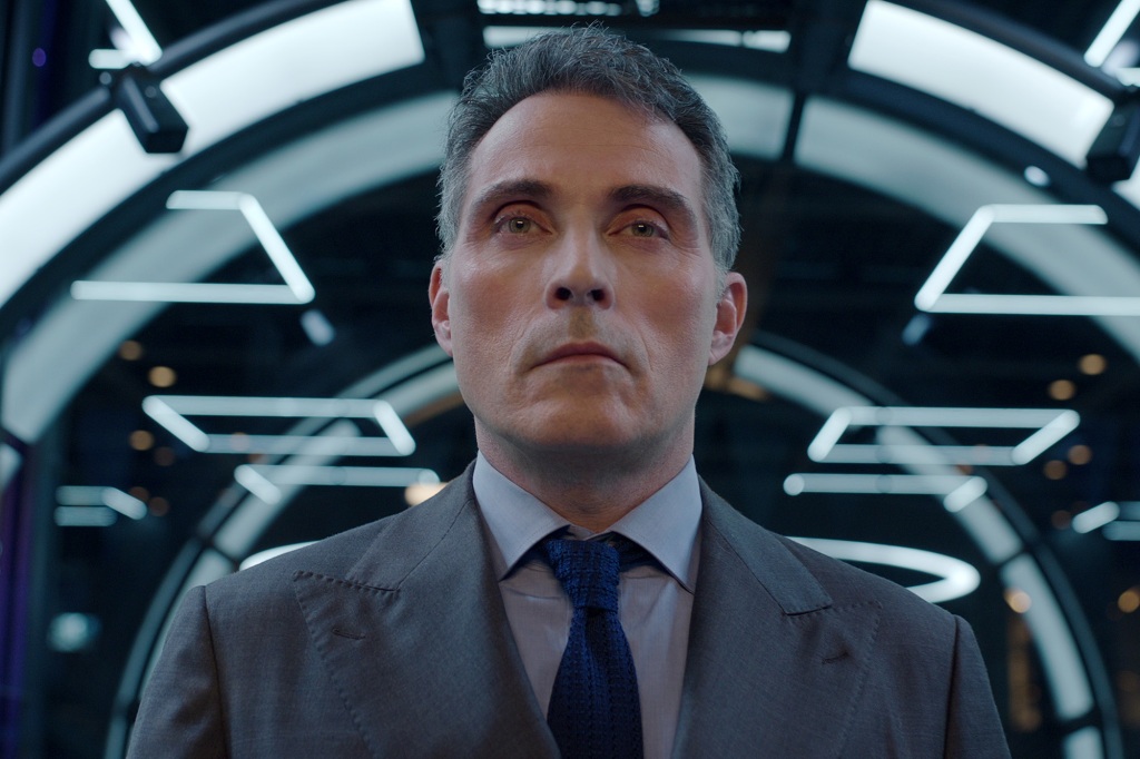 Rufus Sewell as Roger Salas in "Kaleidoscope" in a hall. 