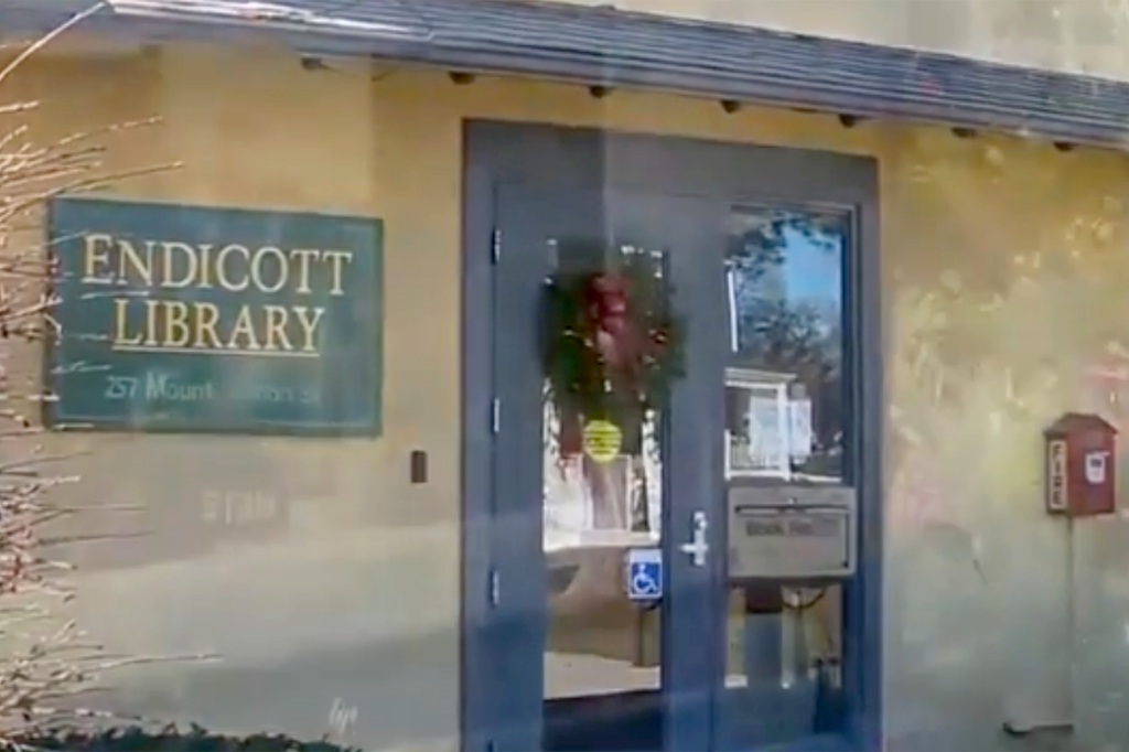 A wreath prominently displayed on the front of the library.