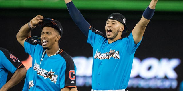 American League All-Star Carlos Correa, right, of the Houston Astros looks on with Francisco Lindor of the Cleveland Indians during Gatorade All-Star Workout Day ahead of the 88th MLB All-Star Game at Marlins Park July 10, 2017, in Miami, Fla. 