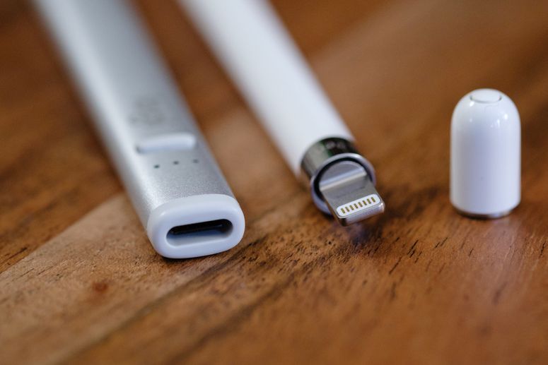 A close up shot of the Logitech Crayon’s USB-C port and the 1st Gen Apple Pencil’s lightning plug.