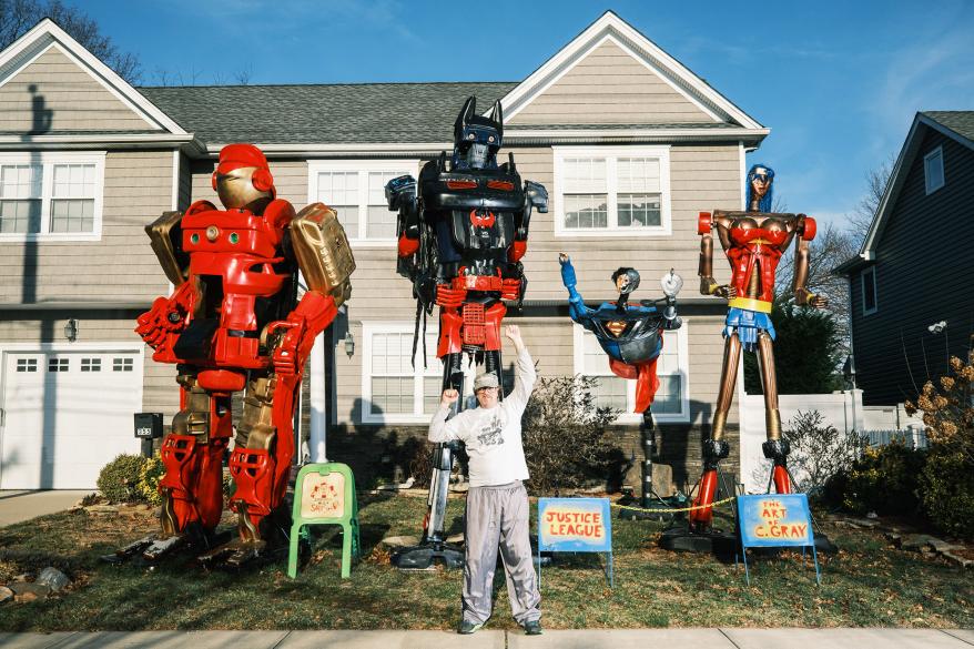Curt Gray displays comic book heroes and villians on the lawn of his East Meadow home.