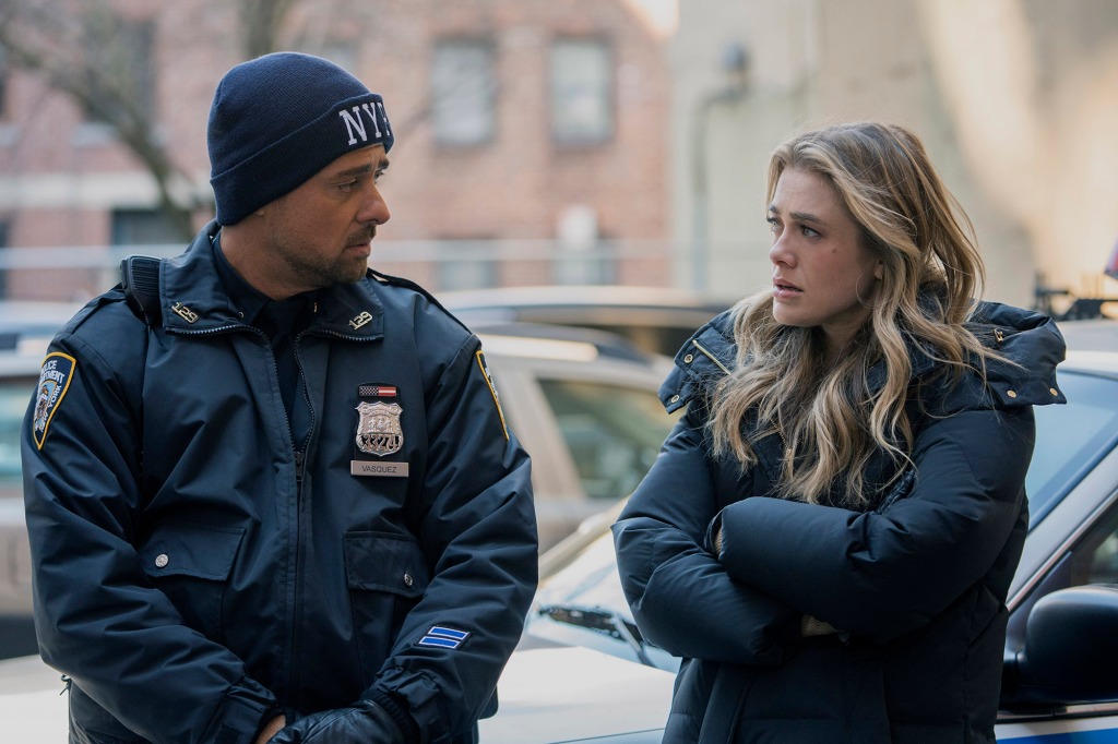JR Ramirez (Vasquez) and Melissa Roxburgh (Michaela) in a Season 4 scene. They're outside and it's cold;  Vasquez is wearing a wool cap with NYPD emblazoned across the front; Michale is wearing a winter coat and has her arms folded trying to keep warm.