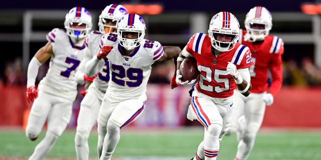 Marcus Jones (25) of the New England Patriots runs for a first quarter touchdown against the Buffalo Bills at Gillette Stadium Dec. 1, 2022, in Foxborough, Mass. 