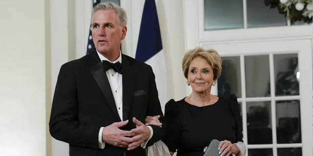 House Minority Leader Kevin McCarthy of Calif., and his mother Roberta McCarthy arrive for the State Dinner with President Joe Biden and French President Emmanuel Macron at the White House in Washington, Thursday, Dec. 1, 2022.