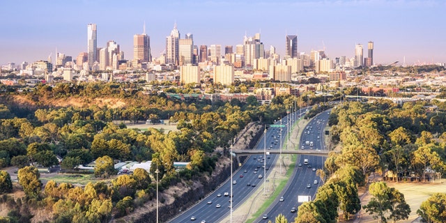 Aerial View over morning commuters towards the city of Melbourne from a hot air balloon, taken at dawn. Melbourne is the capital of Victoria State, Australia