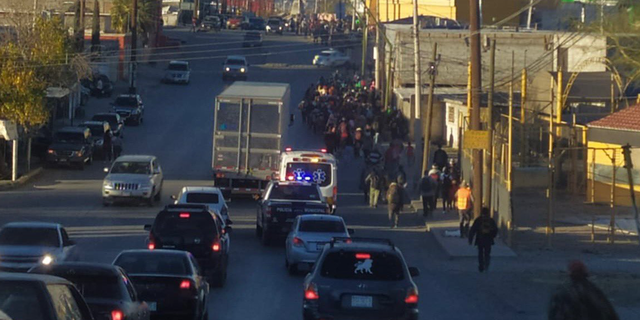 Part of the group of migrants walking to the border after they were dropped off at non-governmental organizations in Ciudad Juarez.