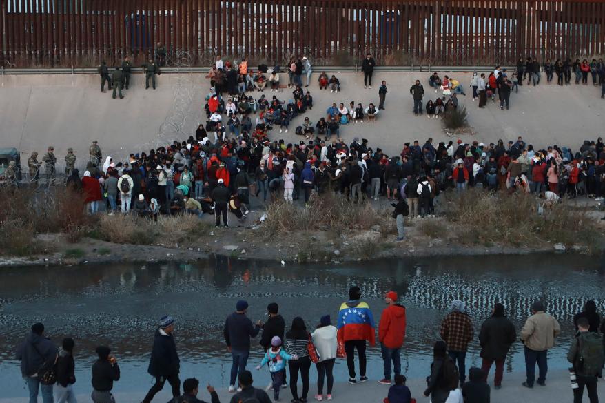Masses of migrants waiting at the US border with Mexico.