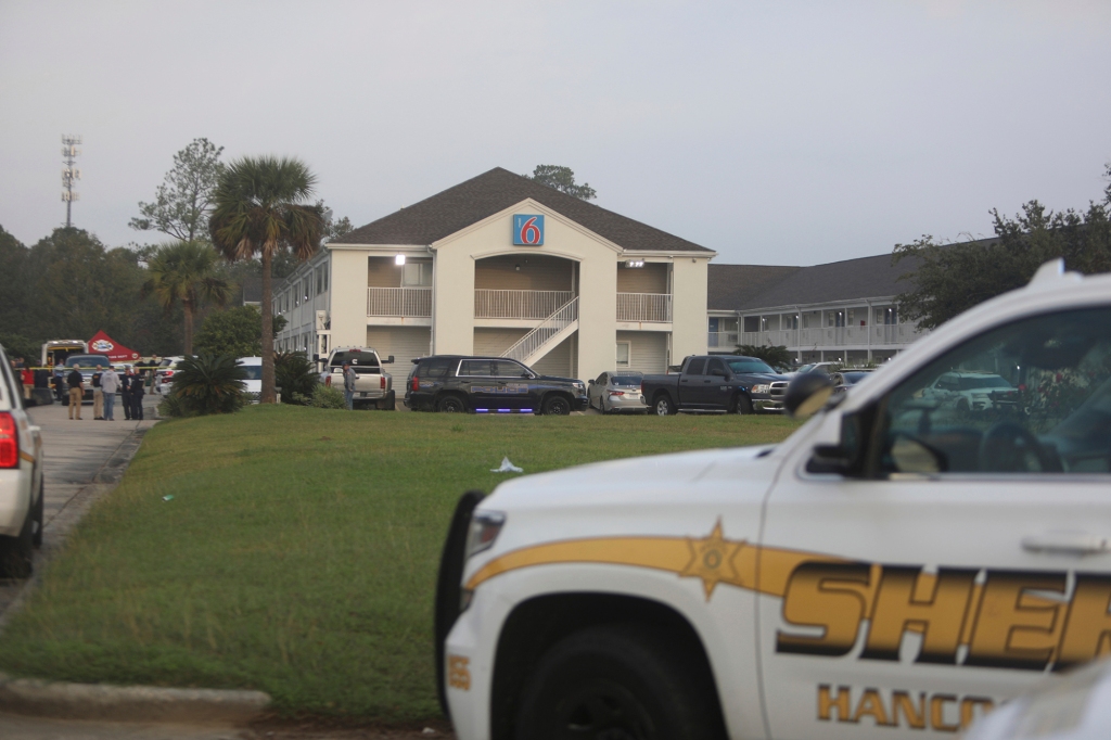 Police on the scene at the Motel 6 early on the morning of Dec. 14.