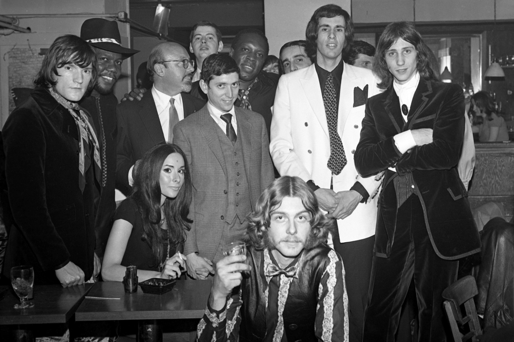The rock band known as Mr. Flood’s Party poses with guests (including Atlantic Records president Ahmet Ertegun, standing next to Curtis) in New York, 1969. 