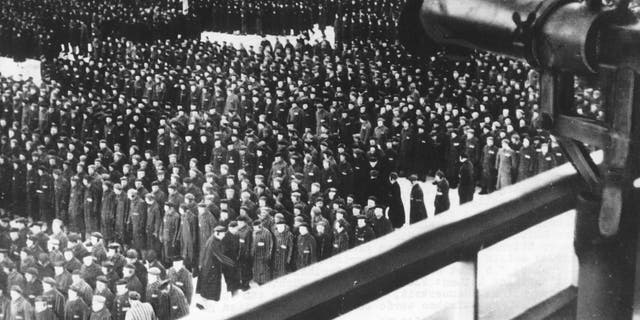 This undated file photo shows a roll call, in the early morning or late evening hours, on the roll call square in front of the camp gate of the Nazi concentration camp Sachsenhausen in Oranienburg on the outskirts of Berlin, Germany. (AP Photo, file)