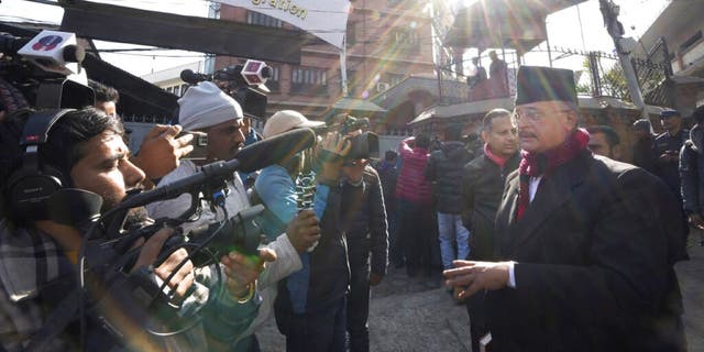 Charles Sobhraj's lawyer Gopal Siwakoti, right, talks to media outside immigration office, in Kathmandu, Nepal, Friday, Dec. 23, 2022. 