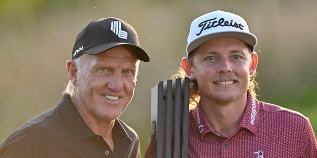 Team captain Cameron Smith of Punch GC, right, poses with Greg Norman, CEO and commissioner of LIV Golf, after winning the individual title at the LIV Golf Invitational - Chicago at Rich Harvest Farms Sept. 18, 2022, in Sugar Grove, Ill.