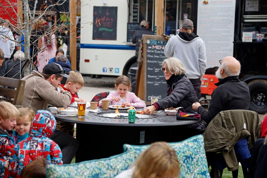 A picture of a residents having lunch while the power is out.