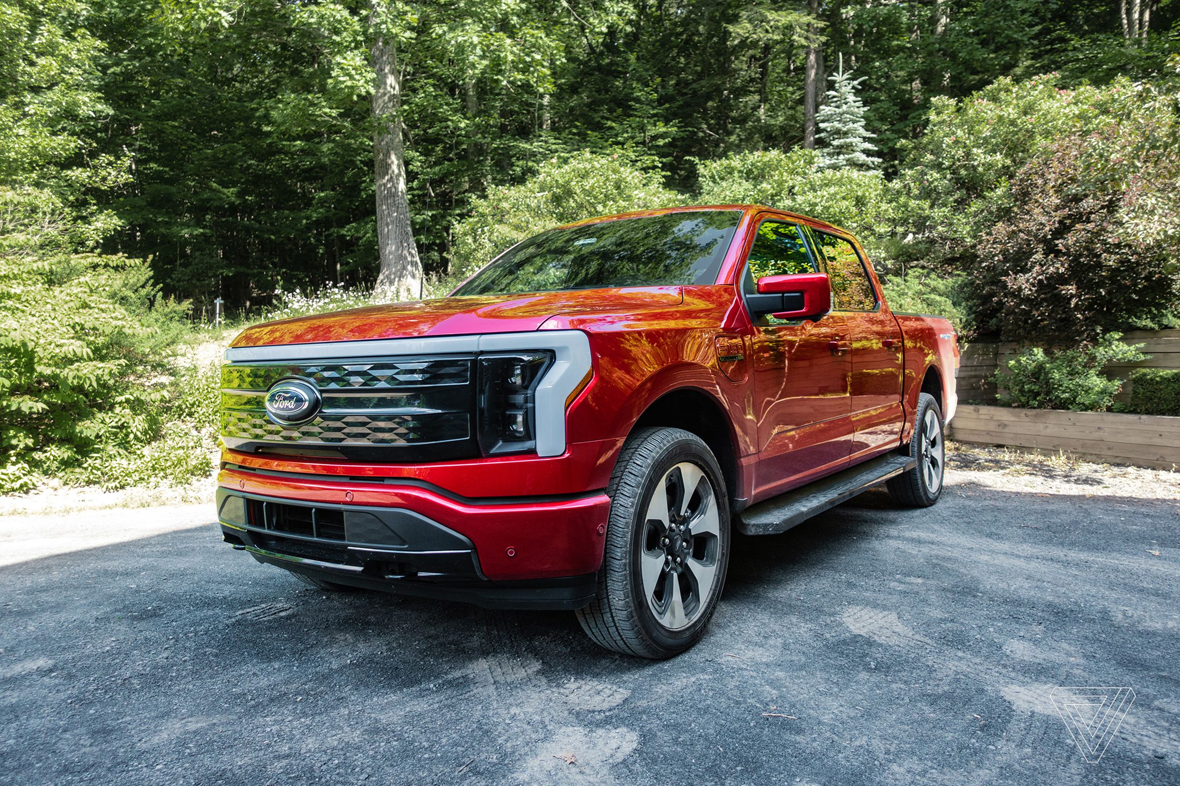 The Ford F150 Lightning in a driveway