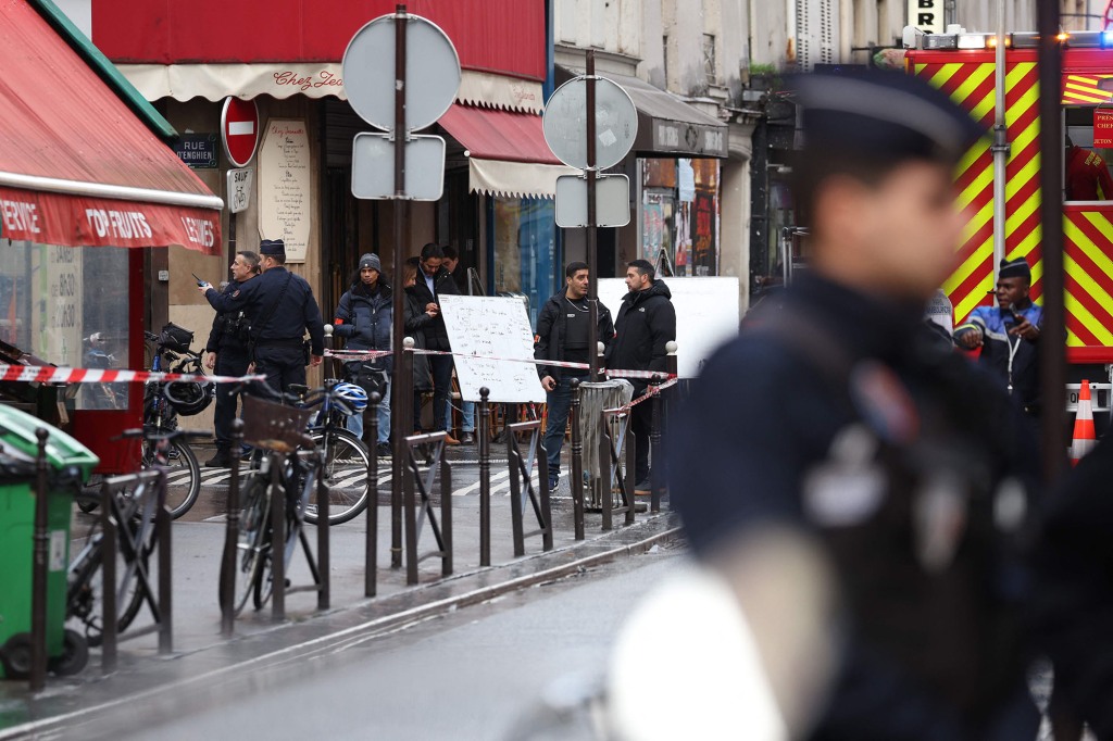 French police secure the street after several shots were fired along rue d'Enghien in the 10th arrondissement, in Paris