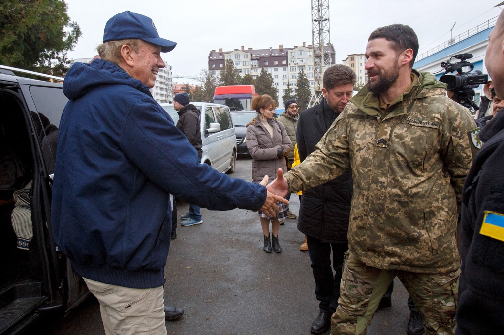 President of the Ukrainian League of American Football (ULAF) Yurii Hundych (R) welcomes American lawyer and politician, former governor of New York George Pataki