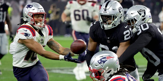 Rhamondre Stevenson #38 of the New England Patriots laterals the ball during the fourth quarter against the Las Vegas Raiders at Allegiant Stadium on December 18, 2022 in Las Vegas, Nevada.