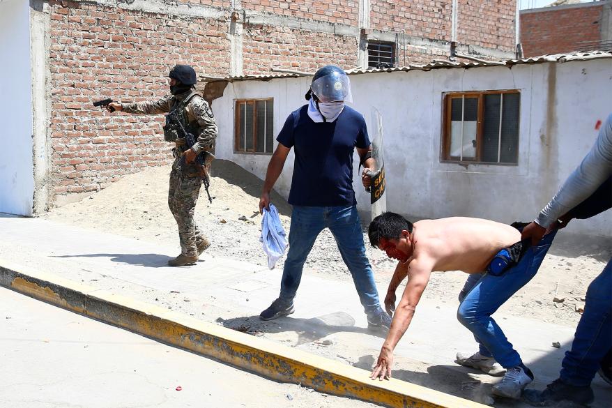 Security forces detain a supporter of ousted Peruvian President Pedro Castillo