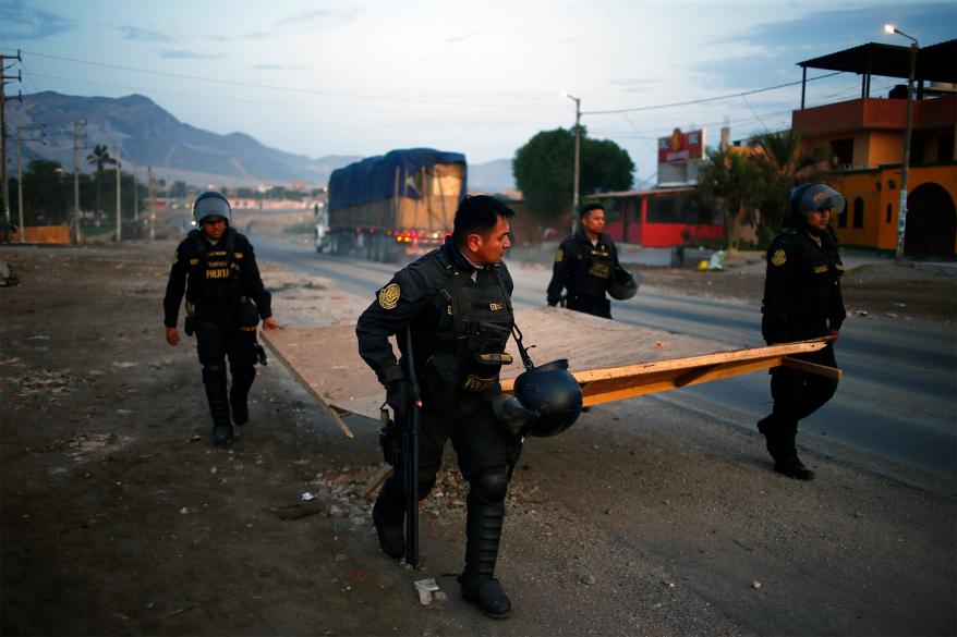 Police clear the Pan-American North highway amid ongoing protests