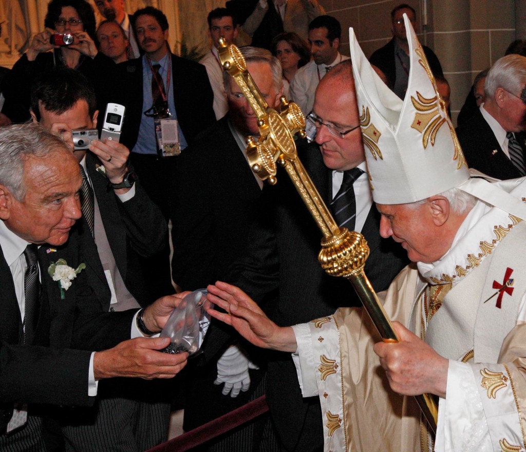 Pope Benedict XVI pauses to bless a bag of rosary beads for Dr. Thomas Rizzo after mass Saturday, April 19, 2008 at St. Patrick's Cathedral in New York.