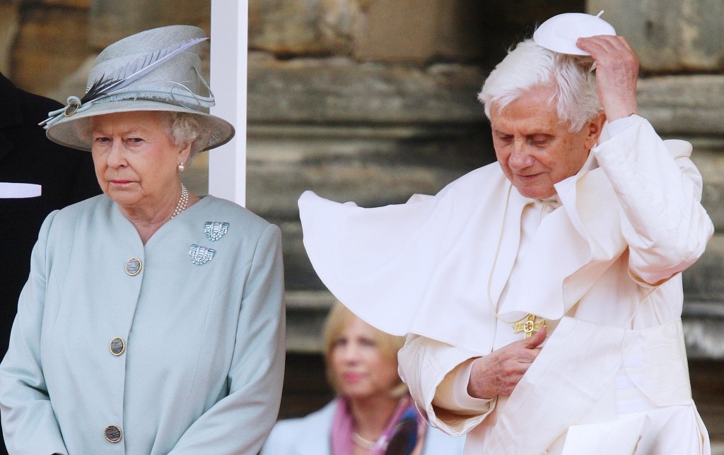 Pope Benedict XVI (R) replaces his zucchetto as he meets with Queen Elizabeth II during day one of his four day state visit to the United Kingdom at Holyrood House on September 16, 2010.