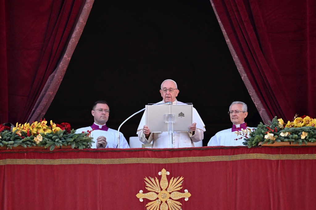 Pope Francis delivers his message from the balcony 