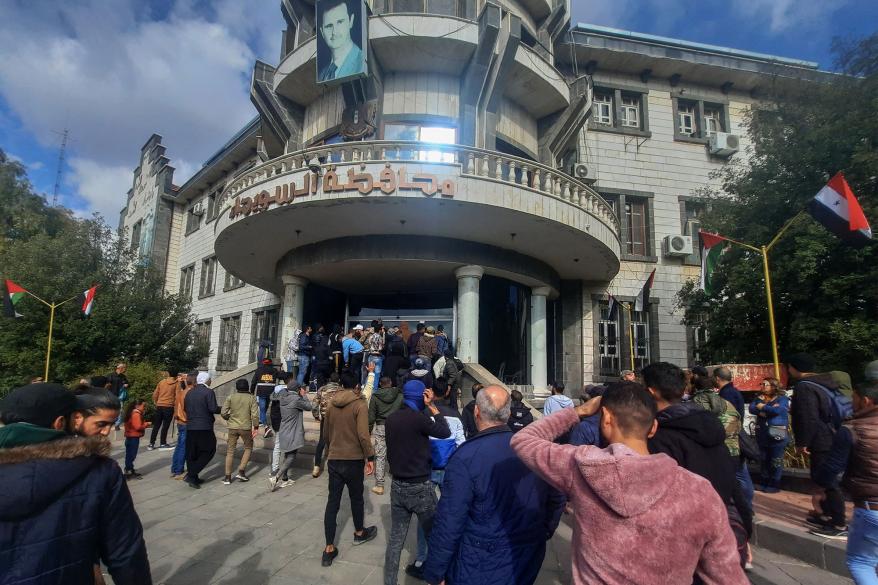 People gather as they take part in a protest in Sweida, Syria.