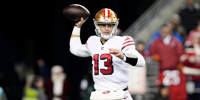 Brock Purdy #13 of the San Francisco 49ers throws a pass against the Seattle Seahawks during the first half at Lumen Field on December 15, 2022 in Seattle, Washington. 