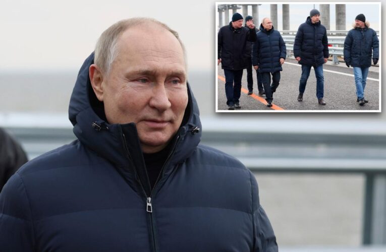 Vladimir Putin drives on repaired Crimea bridge in PR stunt